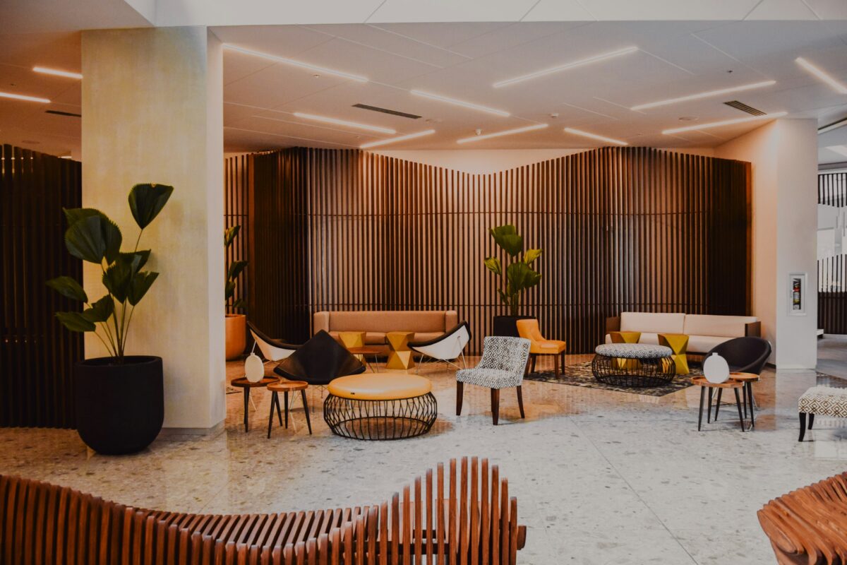 Modern hotel lobby with designer furniture and wood walls