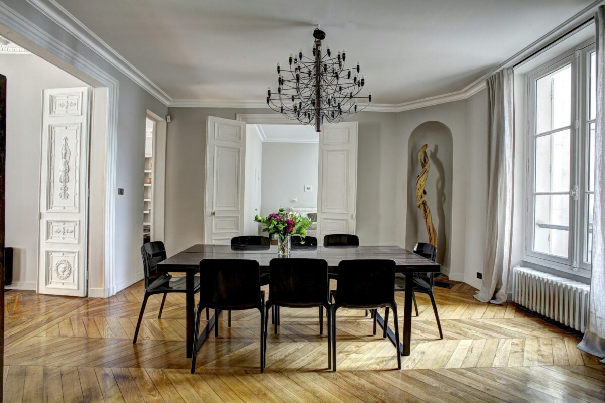 Brown wooden dining set inside room