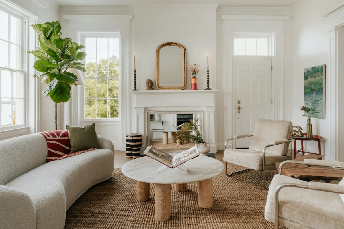 A living room filled with furniture and a fire place