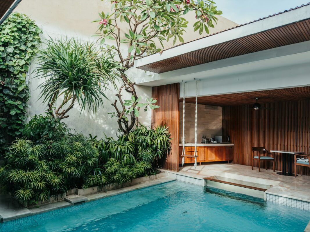A pool with a table and chairs next to it