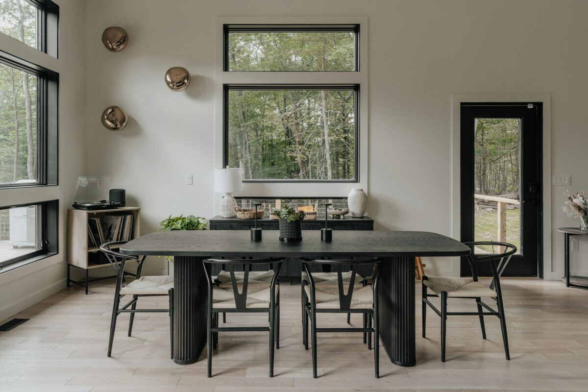 A dining room with a table and chairs